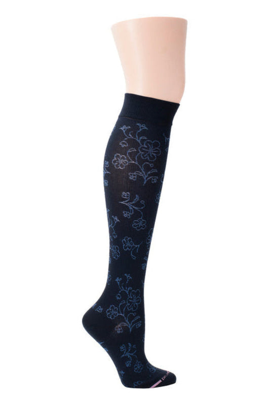 Navy blue knee-high sock with floral pattern on a mannequin leg against a white background